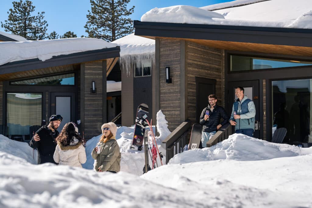 Friends enjoying the outside weather while looking at the snow