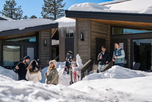 Friends enjoying the outside weather while looking at the snow