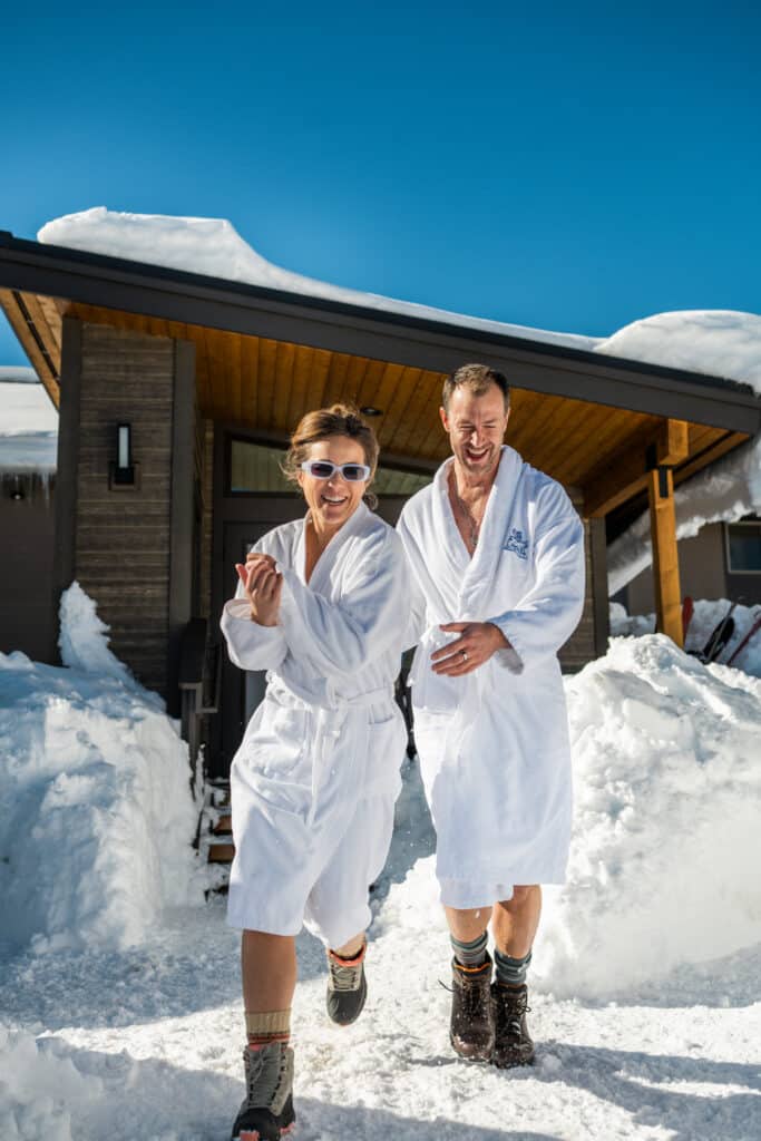 Winter at Outbound Mammoth A couple in robes at Outbound Mammoth