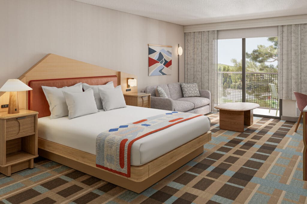 Outbound-Hotels-Park-City-Rooms-Delux-King King bed and seating area in a Park City hotel room