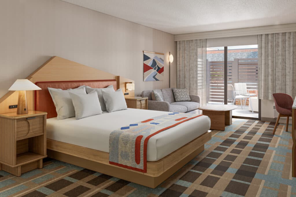 Outbound-Hotels-Park-City-Rooms-King-Patio Patio and firepit outside a Park City hotel room