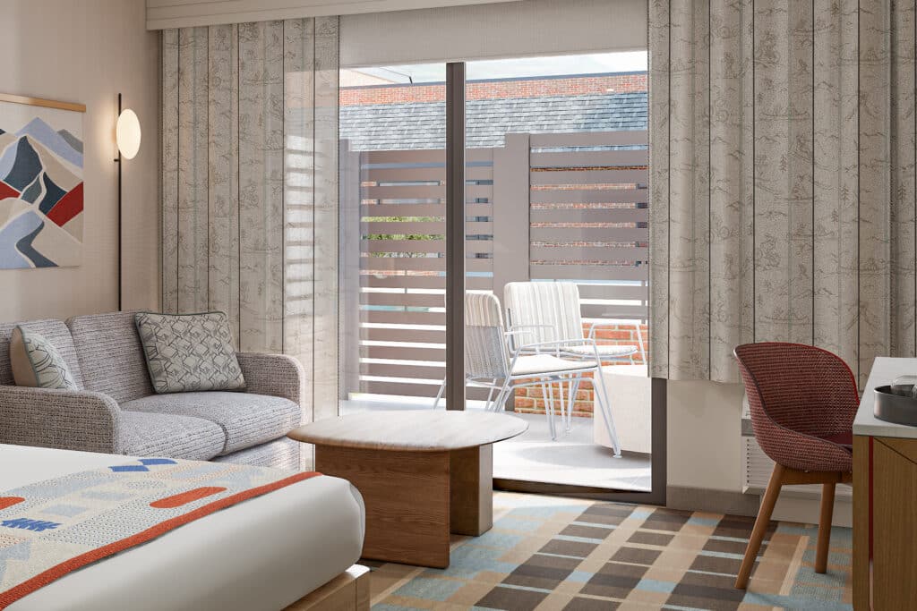 Outbound-Hotels-Park-City-Rooms-King-Patio-2 King bed and seating area in a patio guestroom