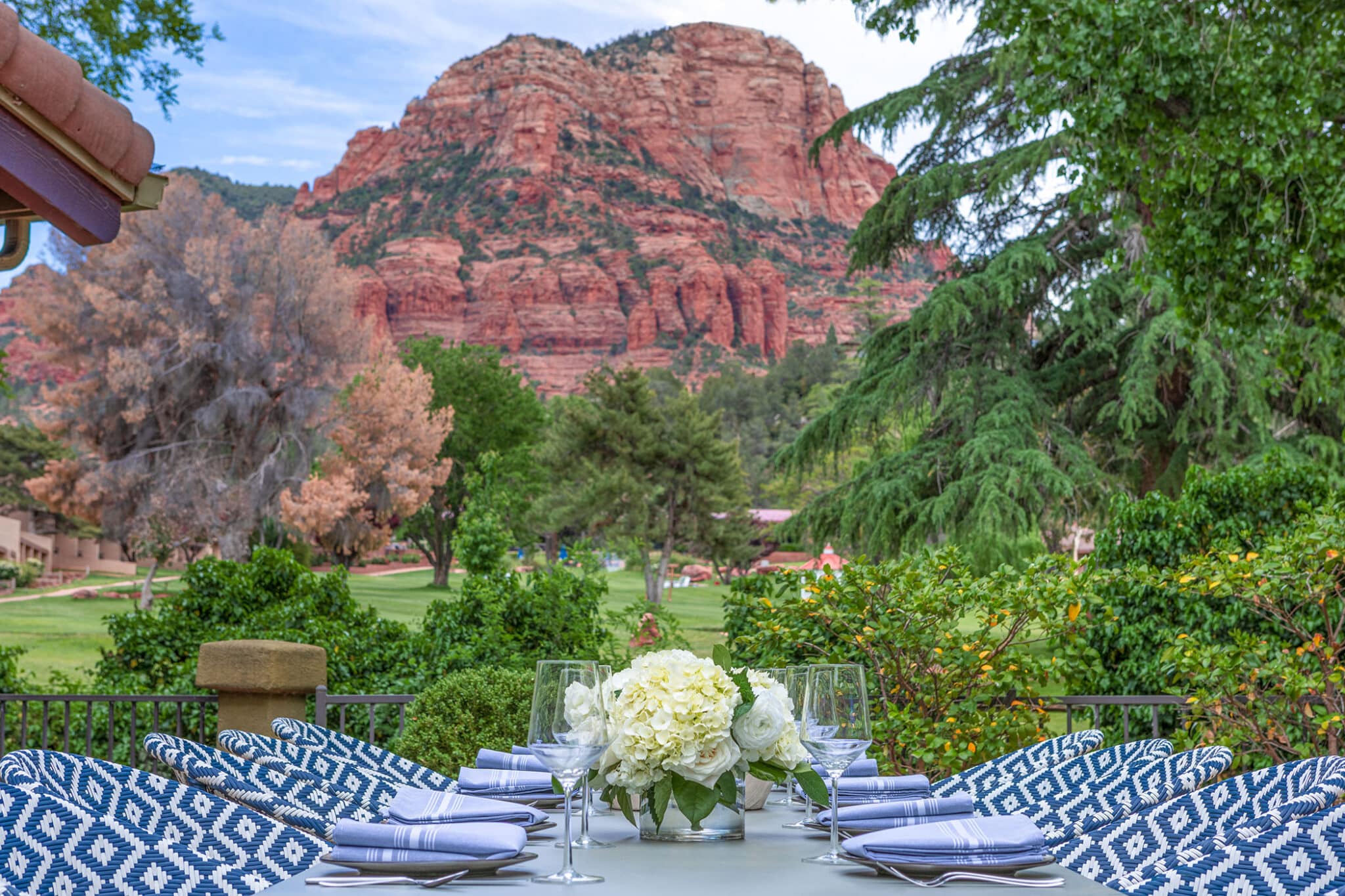 An outdoor dining setup with a beautiful mountain view.