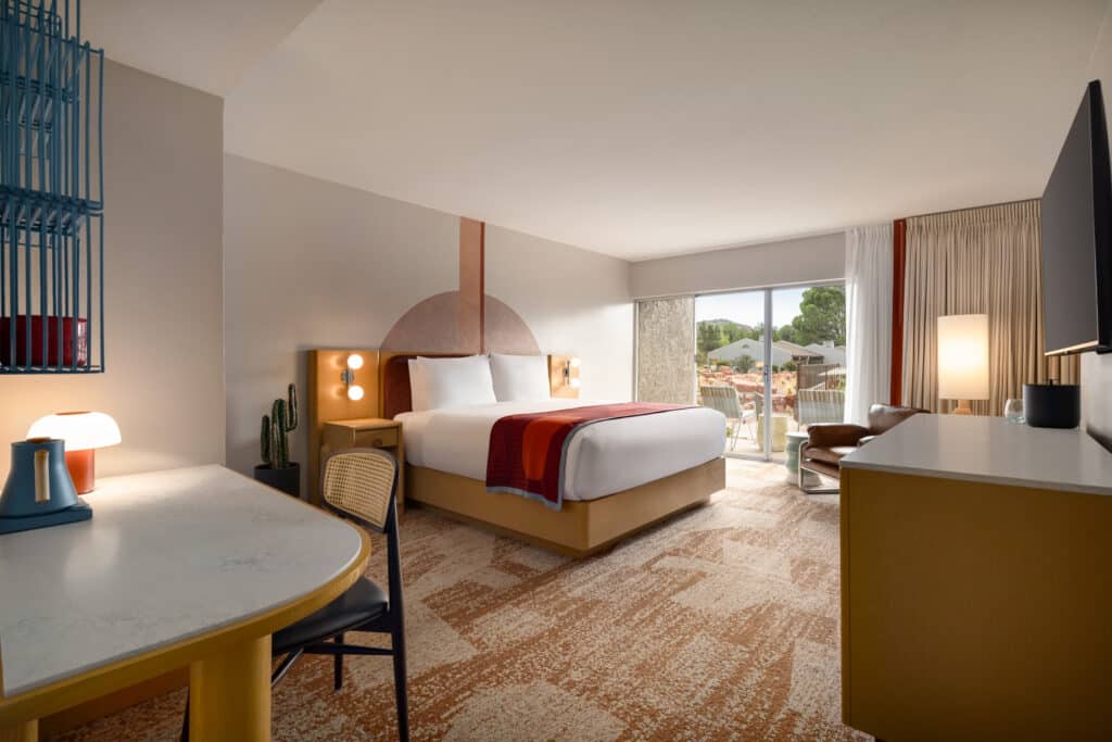 2026-06-19_Outbound Sedona_Pool Patio King_Rm 109_TORT7837 Pool Patio King room at Outbound Sedona with a king bed and private patio overlooking the pool and red rock views