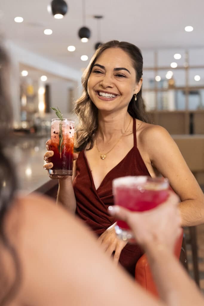 Woman enjoying a cocktail at Outbound Sedona