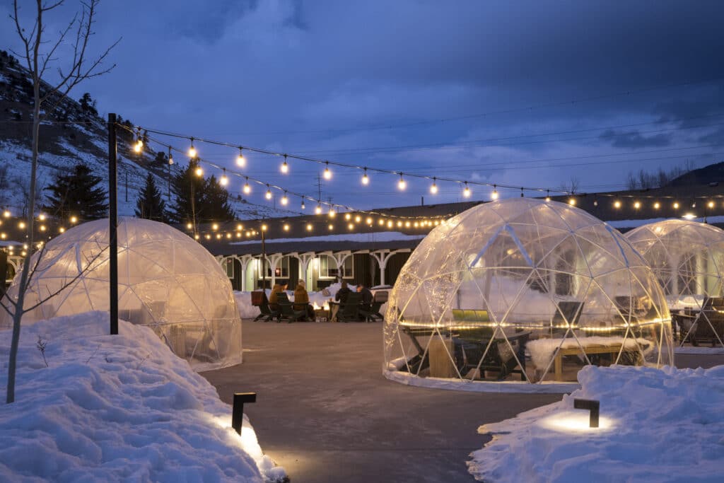 1-45 An evening view of the outdoor dining snow globes at our hotel in Jackson Hole