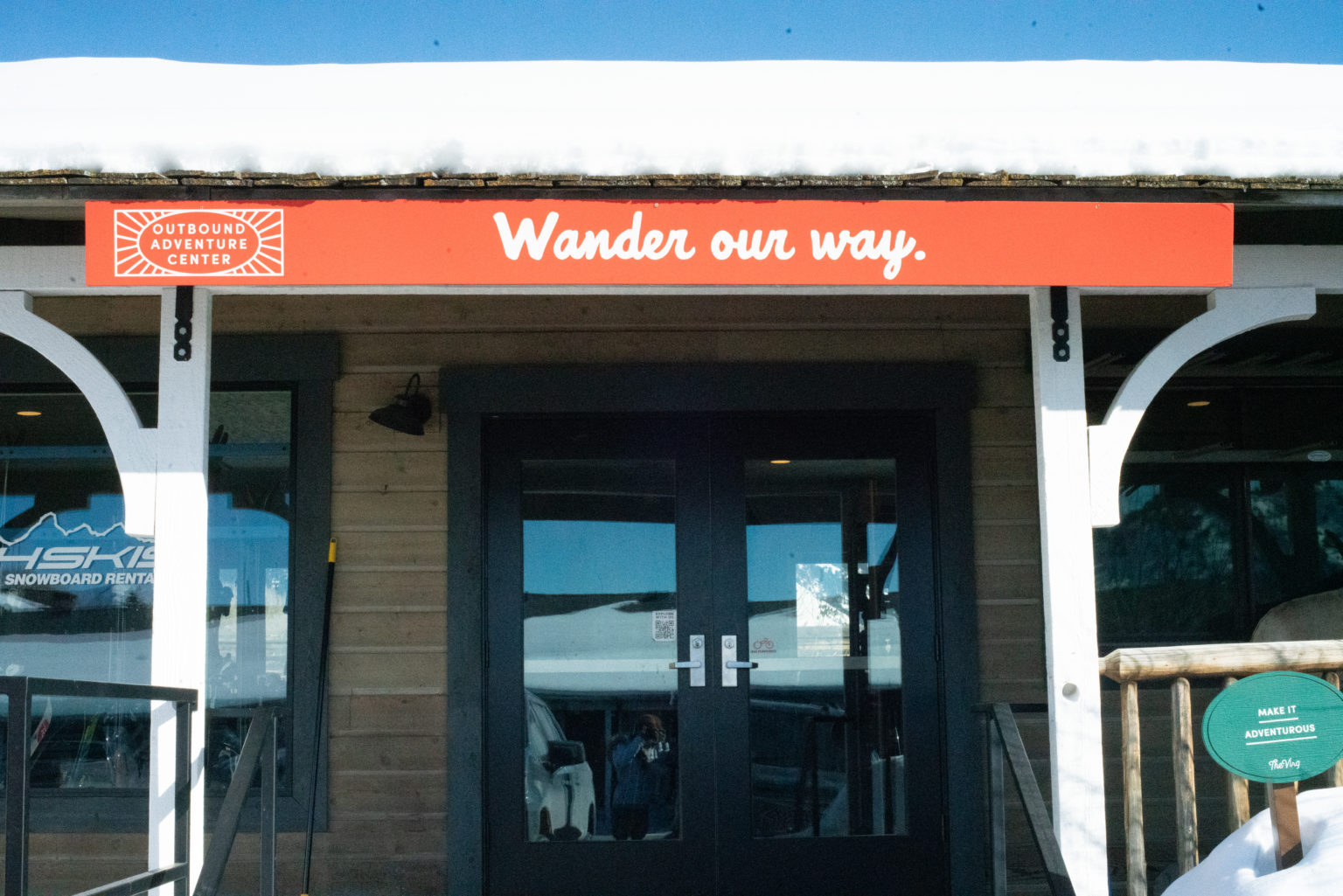 Entrance sign reads "Outbound Adventure Center - Wander Our Way," inviting exploration and discovery.