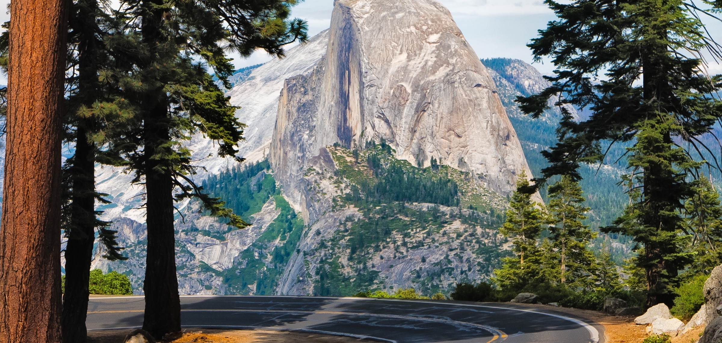 Yosemite road with snow capped mountain