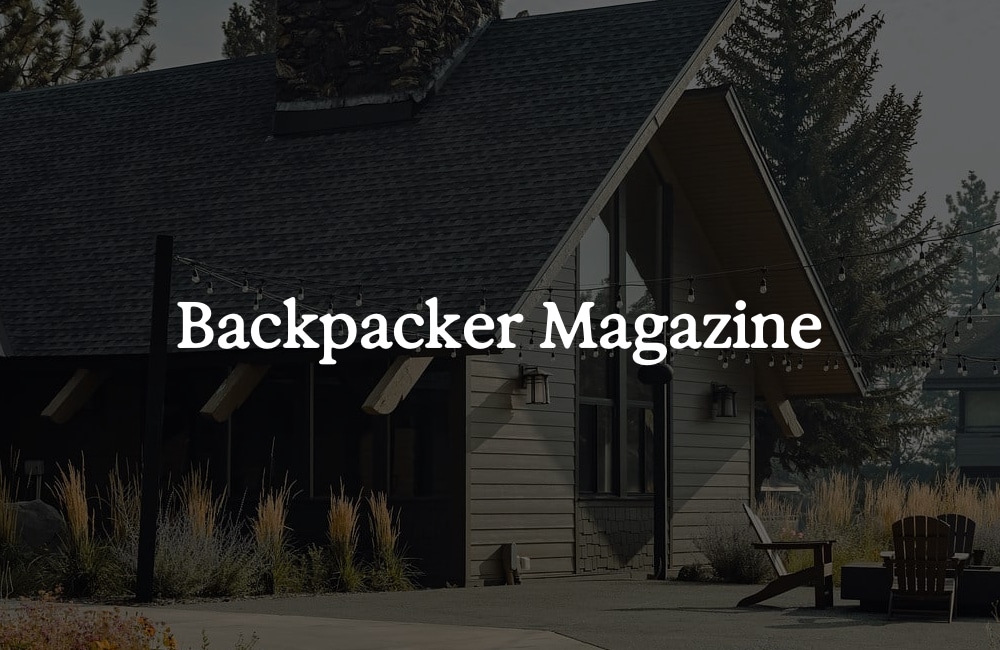 Cabin exterior with “Backpacker Magazine” text overlay.