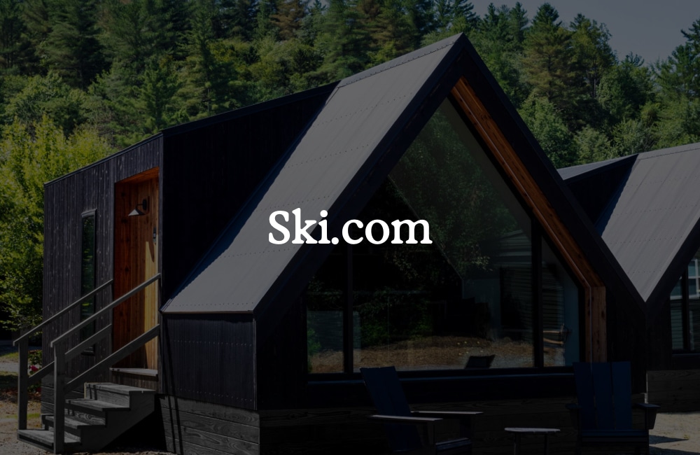 Outbound Stowe A-frame cabin with "Ski.com" title overlay.